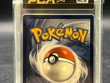 a close up of a pokemon card in a plastic case