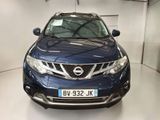 the front of a blue nissan murano parked in a garage