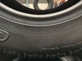 tire tread on a car tire with the word goodyear written on it