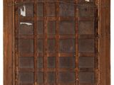 an old wooden window with a grid pattern on it