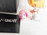 a toy that is sitting on a table next to a book