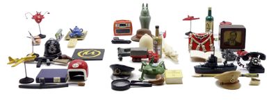 a lot of toy figurines that are on a white surface