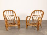 pair of rattan chairs in the style of a pair of armchairs