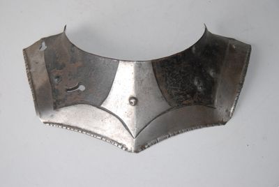a close up of a metal object on a white surface