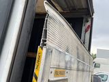 a truck that has a door open and a sign on it