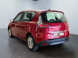 a picture of a red car parked in a showroom