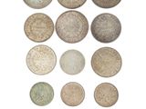 an image of a bunch of coins sitting on top of a white surface