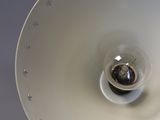 a white lamp that is on top of a table