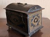 a small black box sitting on a wooden table