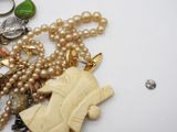 a necklace that has a picture of a woman on it