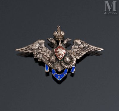 a close up of a badge with two birds on it