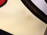 a close up of a piece of fabric with a red and black design on it