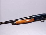 a toy gun that is sitting on a white surface