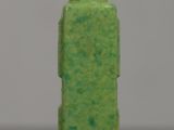 a green vase with a green lid sitting on a table