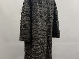 a black and white coat on a mannequin mannequin mannequin mannequin mannequin mannequin mannequin mannequin mann