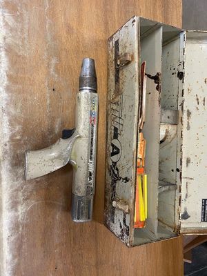 a box that has a hammer and a toothbrush in it