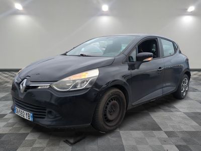 the black car is parked on a checkered floor in a garage