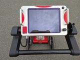 a small child ' s tablet computer on a cart