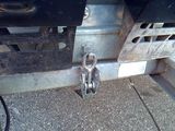 a close up of a truck with a chain attached to it