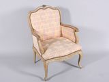 an image of a chair with a plaid upholstered back and arms
