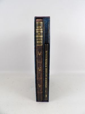 a pair of books sitting on top of each other on a table