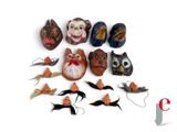 a lot of masks that are sitting on a white surface