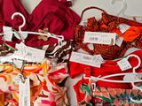 many different types of clothing on display on a table
