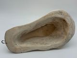 an image of a wooden shoe on a white surface