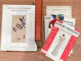 many books on the table and a book on the table