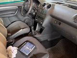 a small car with a tablet in the passenger seat
