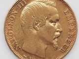 l'image d'une pièce d'or sur laquelle figure le visage d'un homme