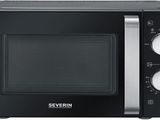 the microwave is black and silver with the door open