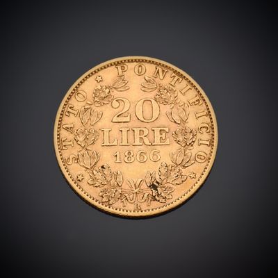 un gros plan d'une pièce d'or sur laquelle figure le chiffre vingt