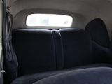 a seat in the back of a car with a window open