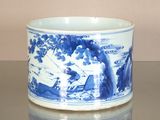 a blue and white cup sitting on a table