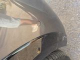 a black car with a sticker on the side of it