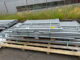 a pile of galvaniized steel pipes on a pallet