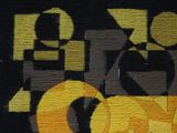 a black and yellow rug with the word ok on it