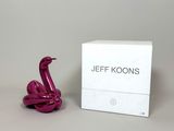 jeff koons pink flamingo sculpture in front of a white box