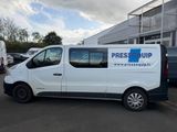 the white van is parked in front of the building