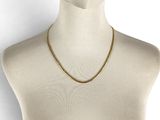 a close up of a mannequin head wearing a gold chain necklace