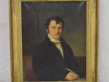 portrait of a man in a black coat with a white collar