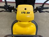 a close up of a yellow motorcycle with a black handlebar