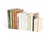 many books that are stacked on top of each other