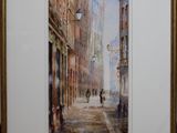 aquarelle encadrée représentant une scène de rue dans une ville