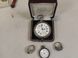 a box with a watch and several other jewelry items