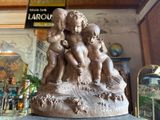 a statue of a group of cherensils on top of a table