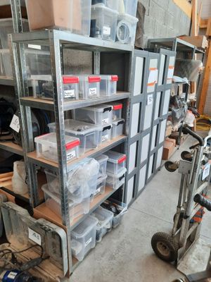 many boxes and boxes on the shelves in the garage