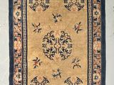 a close up of a rug hanging on a wall