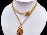 a close up of a necklace on a mannequin mannequin